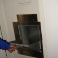 Vertical service shafts and trash chutes are isolated from corridors in multistory buildings by locating them within the vestibules