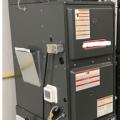 A static pressure measurement is taken on this air handler using probes on the supply and return sides of the fan. 