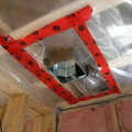 The polyethylene ceiling vapor barrier is sealed to form an air barrier around the exhaust fan in this very cold climate location (≥ CZ 6).