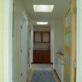 Solar tubes are installed in the hallway to bring sunlight into the interior of the home.
