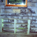 Moisture from sprinkler seeped through the concrete block causing water stains and mold inside.