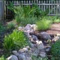 Bioswales or rain gardens filter storm water through vegetation and rock and sand substrate layers.