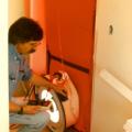 A blower door is used to test air leakage in this multifamily building during construction 