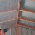 This builder applied an air-sealing layer of spray foam along the underside of the roof deck and the inside of the walls before filling the wall cavities with blown cellulose.