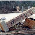 Wrong – Piers set on individual footings with inadequate anchoring to the ground were twisted and toppled by a coastal storm surge, while those anchored in the concrete pad stayed upright. 