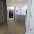 The cabinet above this refrigerator will keep it from tipping forward during a seismic event
