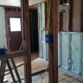 In this gut rehab, drywall was removed then a sprayer-applied sealant was used to seal all large cracks and seams and then the 2x4 walls were filled with spray foam.