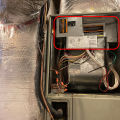 This upflow air handler for a traditional heat pump has an electric resistance auxiliary heating element located at the top of the unit (circled in red).