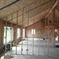 Concrete slabs are used on both the first and second floors of this SIP home to provide passive solar heating from large south-facing windows.
