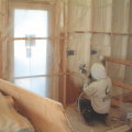 Right - Closed-cell spray foam is installed as a skim coat to provide air tightness to an exterior wall cavity before installing batt or blown cavity insulation.