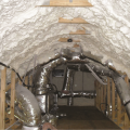 Right - The underside of the attic roof deck is insulated with open-cell spray foam to provide an insulated space for HVAC equipment.