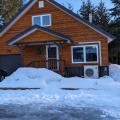 Cold-climate heat pumps can provide heating and cooling even in climate zone 7; this home retained a fuel oil boiler system for backup on the coldest days.