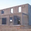 This high-thermal-mass home uses concrete construction for disaster resistance as well as to naturally regulate temperatures inside the house 
