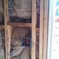 Wrong - Craft faced batt insulation is not cut to fit around wiring and eletrical boxes and is squished into corners forming voids which could encourage cold spots in wall.