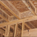 The I-joist is continuous along the shared wall and serves as a natural air barrier between the garage and the house