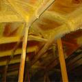 Strengthen an existing roof by applying two-part spray-applied polyurethane foam adhesive to all sheathing and framing joints from the underside of the roof 