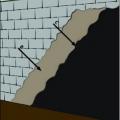 Damp-proof below-grade concrete block walls by coating the exterior surface with parging and an asphalt emulsion or similar product.