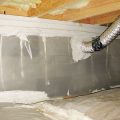 Right - This crawlspace, which is insulated on the floor, has a complete vapor barrier over the floor and up the walls that is sealed at all seams and termite inspection gap at the top of the vapor retarder. 