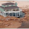 Deep scour around foundation piles from coastal flooding.