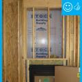 Right –  Rigid air barrier is installed behind fireplace