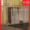 Wrong - The below-grade concrete does not have the correct construction to be impermeable to moisture because the lumber is untreated and against the concrete that lacks waterproofing.