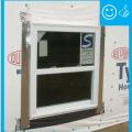 Right – There is flashing installed along the top of the window and the water-resistant barrier is layered over to create a complete drainage system