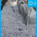 Right – House without gutters has waterproof liner, drain tile, and gravel bed extending more than 5 feet from foundation