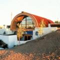 Example of an earth-sheltered home in hot climate Tempe, AZ uses the cooling properties of the ground to decrease cooling costs