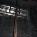An elevator shaft vent with a motorized damper in a multistory multifamily building provides smoke and hot gas control in an elevator shaft during fire events; during normal operation the damper remains closed to reduce energy loss.