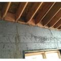 Right - every rafter is secured to the wall framing with metal ties.