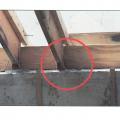 Improperly located masonry-wall-to-wood-frame straps. 
