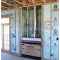 Rigid foam insulates the interior of masonry walls behind the fireplace in this Building America home by Castle and Cooke in Winter Garden, Florida.