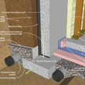 Right - This concrete basement wall is insulated on the interior basement walls with spray foam and under the slab with rigid foam; footing details are shown.