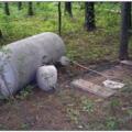 Improperly installed fuel tanks can break free from attachments under the force of flood waters, risking broken fuel lines which could cause fire or explosion. Here, the tank is tethered only by the gas piping, which is not designed to perform this function. 