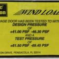 Right - Garage door label shows design wind pressures.