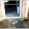 The unprotected glazing in this door was broken by roof tiles dislodged by wind. 