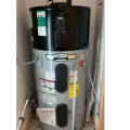 Heat pump water heater is installed in the interior closet of a multifamily dwelling unit