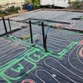 PEX piping loops are laid before the slab is poured for this radiant floor heating system