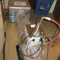 The duct sealing spray injection system includes a blower/heater (background) and the sealant injection unit (foreground)