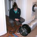 An energy rater uses a duct blower to test HVAC duct air leakage.