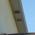 These second-story ventilation air intake/exhaust grilles can be accessed from the lower roof for air-flow testing 