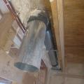 Right – This kitchen exhaust fan duct is made of smooth round steel duct that takes the shortest, most direct route to the outdoors and joints are sealed with mastic. 