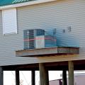 Right – The HVAC compressor sits on a raised cantilever platform away from the base flood elevation. 