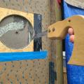 Right - A hand saw is used to remove wall material for a small through-the-wall HRV; 6 of 14.