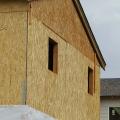 Wrong - House wrap is not fully attached to sheathing.
