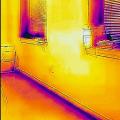 Wrong - This IR image is showing a lack of air-sealing is allowing cold air to enter the home around the windows and at the base of the wall.