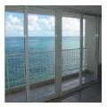 Right - Impact-resistant glass protects windows from wind-borne debris and is always in place, requiring no manual deployment during a storm.