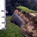 This gasoline tank was lifted out of the ground by the buoyant forces of flood waters in the Iowa flood of 2008.