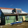 This roof is hurricane proofed with a coated insulated OSB deck sheathing that is caulked and taped at all seams with a water-resistant tape, then fully covered with a peel-and-stick membrane, and asphalt shingles.