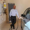 Solar electric panels provide electricity for the home and an electric car charging station.